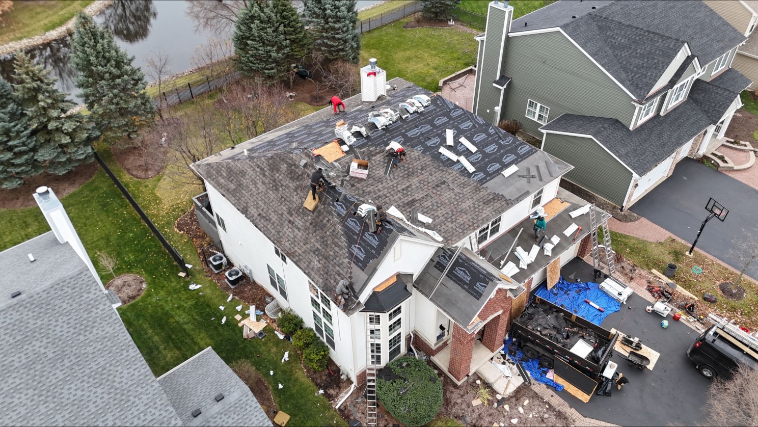 Aerial view of a roof replacement in progress on a DFW home